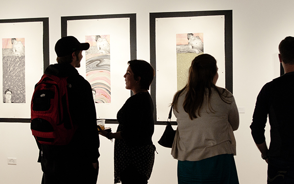 patrons view art in the gallery