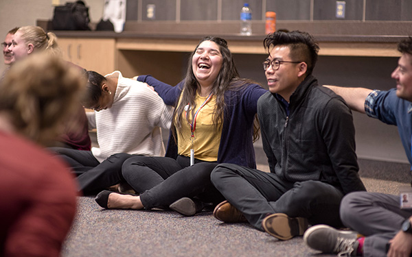 students in class full of joy at Regis University