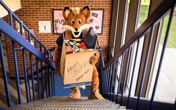 Regi moving in to his dorm during move-in at orientation.