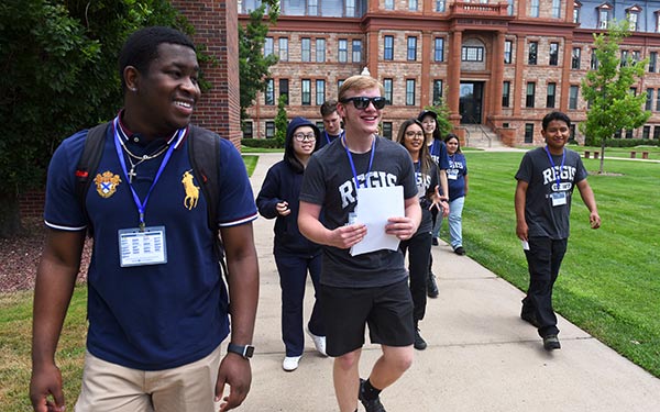 Pharmacy students walking and touring campus