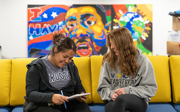 Regis students connecting on campus