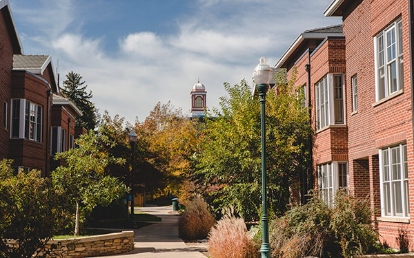 view down walkway between residence village buildings