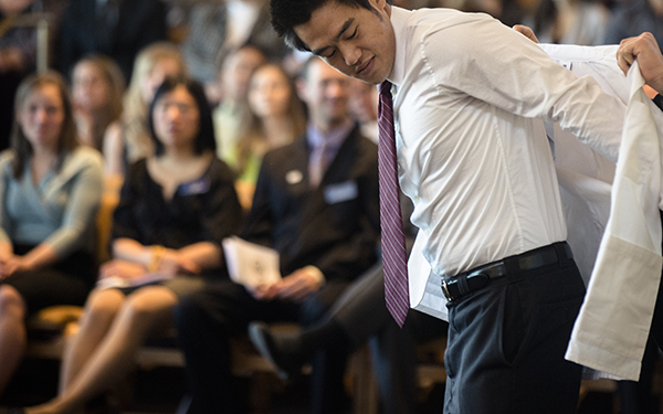 RHCHP student receiving his white coat