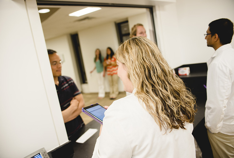 Pharmacists helping customers