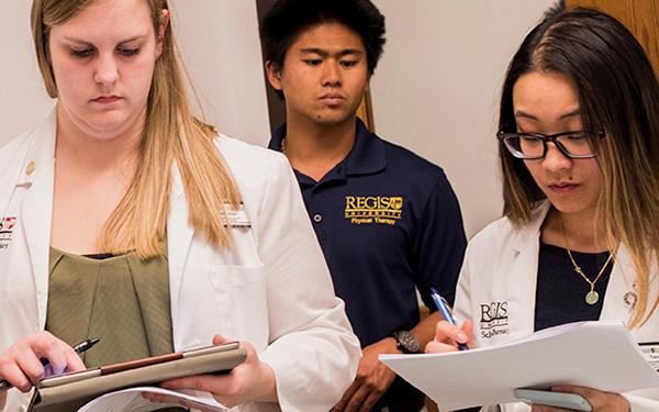 nursing students reviewing data on clipboards