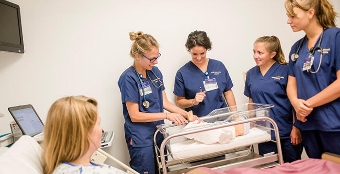 nurses using medical mannequin