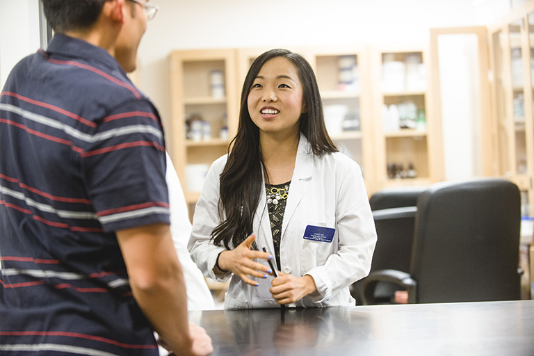 Pharmacist helping customer