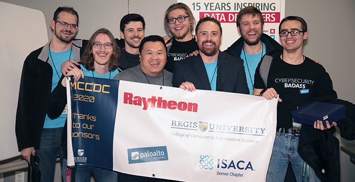 winners of the 2020 competition pose with a banner thanking the event's sponsors