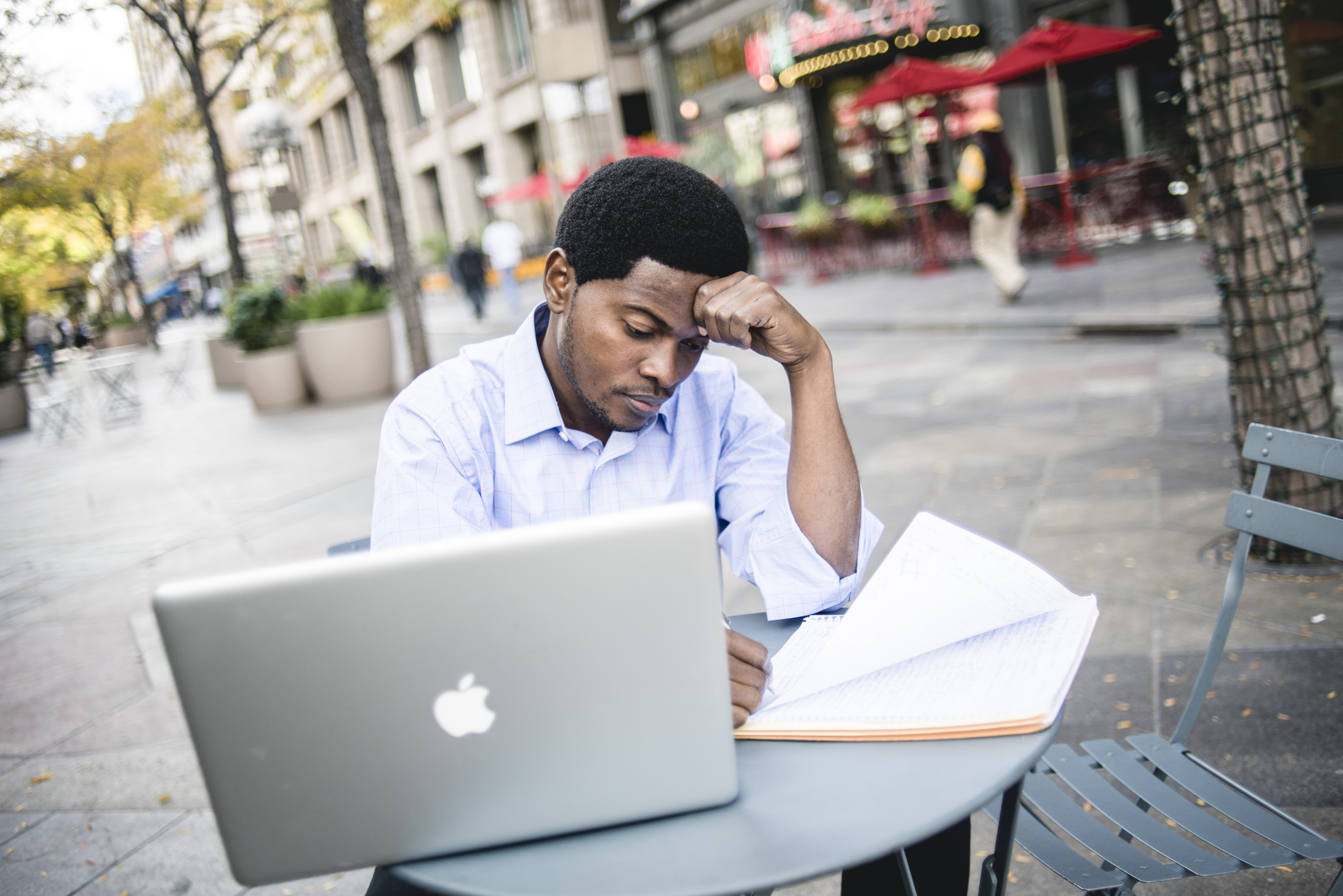 capstone student working on thesis outdoors