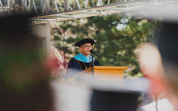 president aceves speaking at commencement