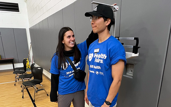 Regis students at a health fair