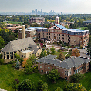 Southeast-facing aerial view of the Northwest Denver campus with Denver skyline