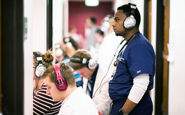 Healthcare students with book icon on top of image