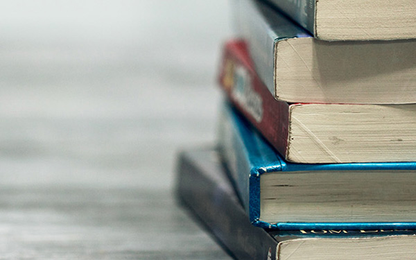 stack of books on a desk