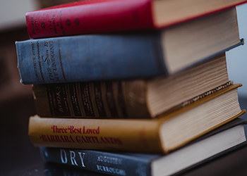 stack of old books on a table