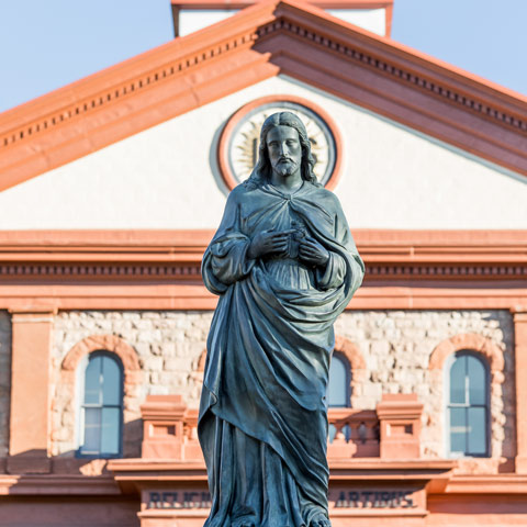Statue of Jesus outside a campus chapel, reflecting the university’s Jesuit Catholic tradition.