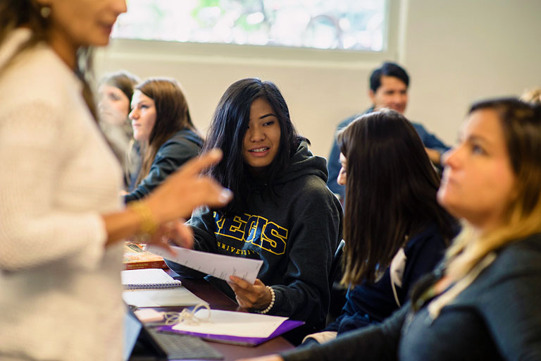 Regis students during experiential learning opportunity