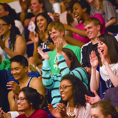 Regis students cheering in crowd