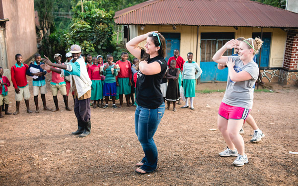 Students dancing with locals in Uganda during a moment of cultural exchange.