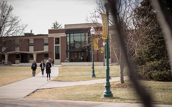 students walk along the quad in the winter