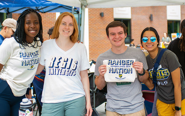a group of students smile outdoors during Welcome Week