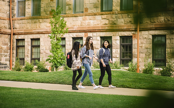 Students walk to class on a sunny day