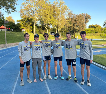 Students pose on a track for a group photo