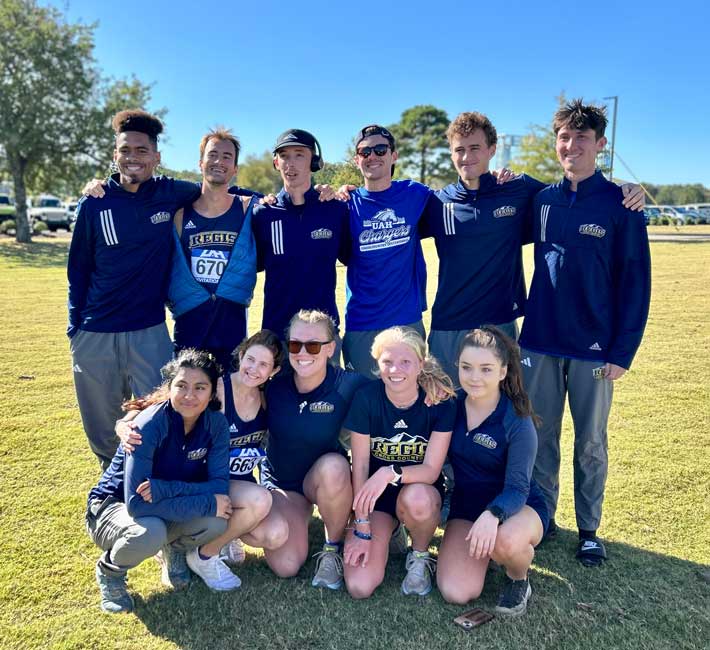 Many track students pose together for a group shot