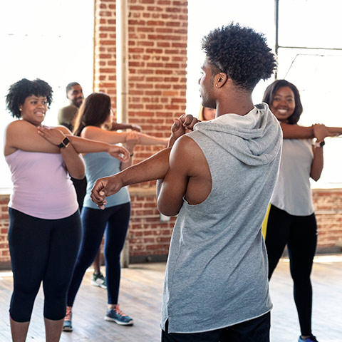 a Health and Exercise Science student leads a strength training class