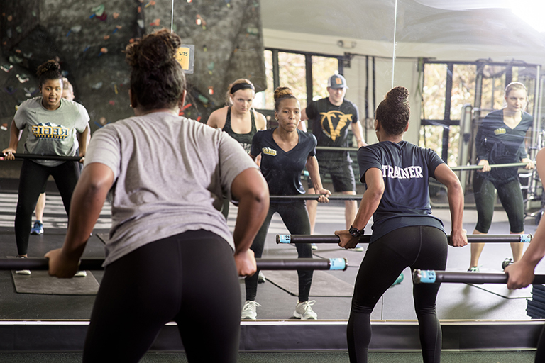 trainer instructing a fitness class