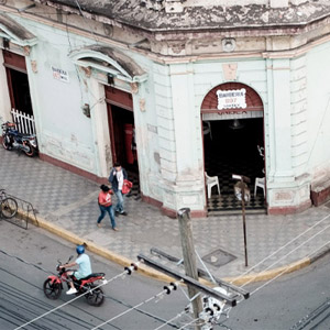 street intersection with pedestrians and scooter