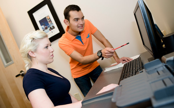 student tutoring at computer