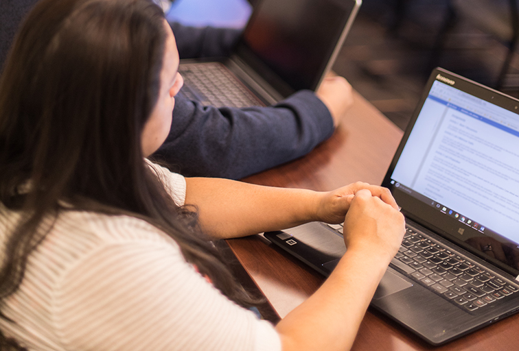 woman in classroom on computer