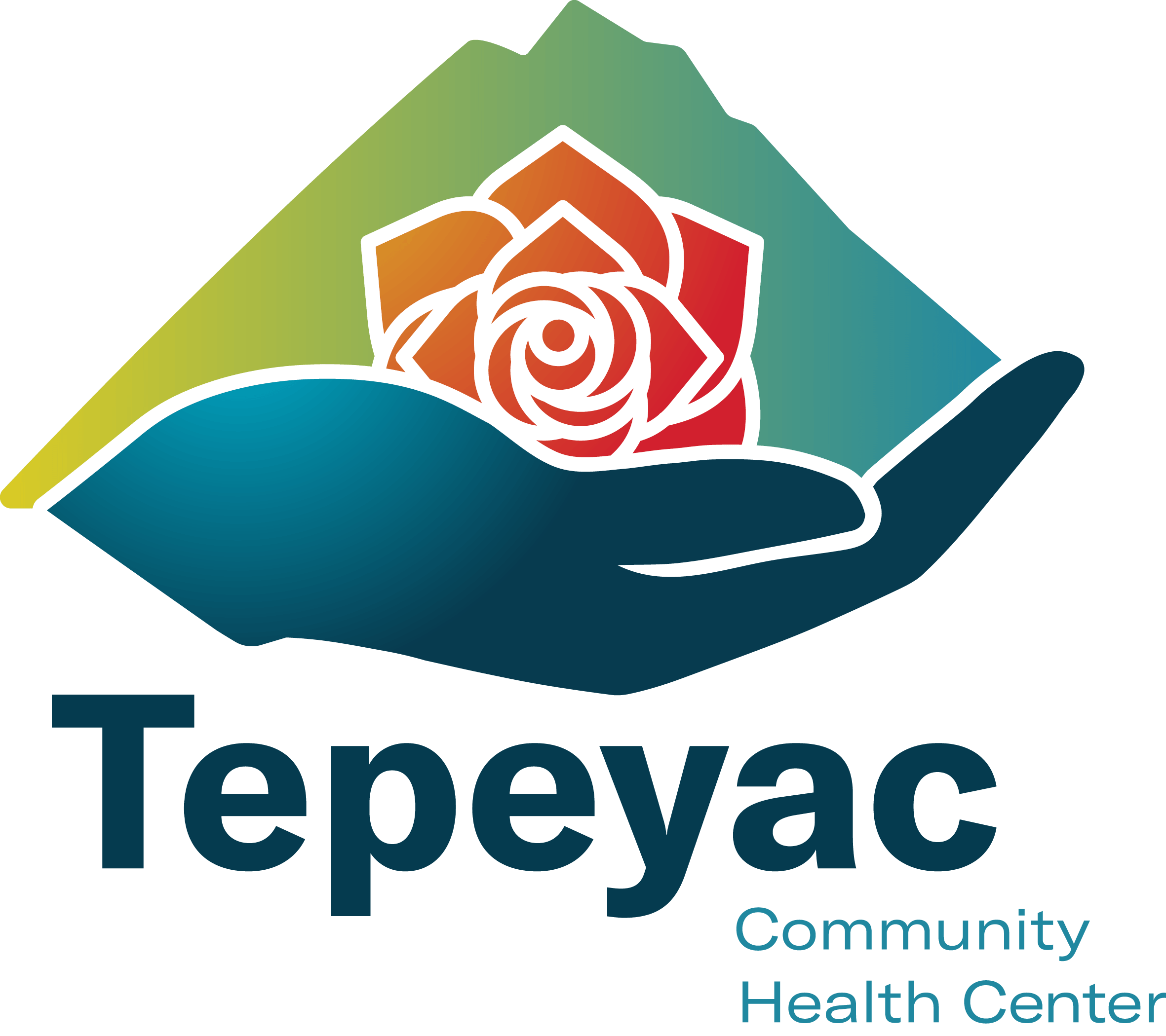 Hand holding a rose and mountain. Tepeyac Community Health Center