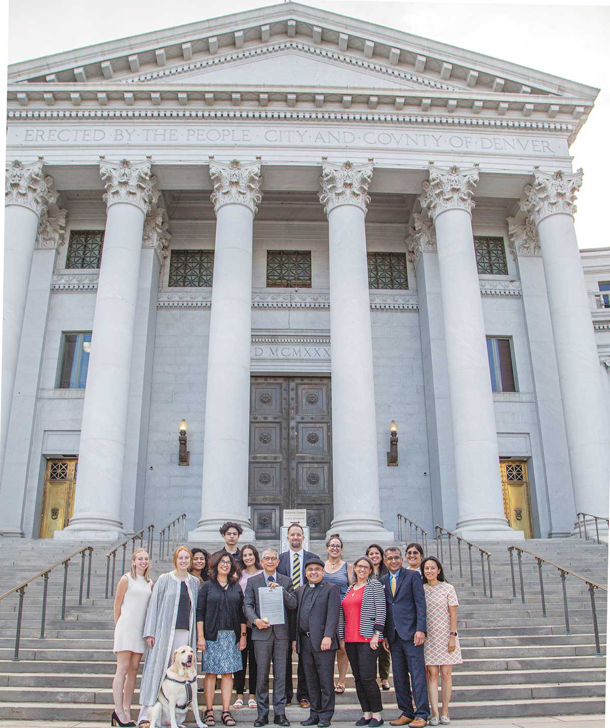 President Salvador Aceves, students, faculty and staff pose for a photo in front of the  Denver City Council building after being awarded a proclamation recognizing the University's status as a Hispanic Serving Institution in Denver Colorado