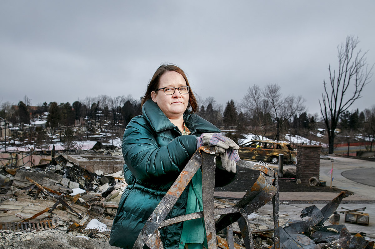 Annica Dino stands among the rubble of her home