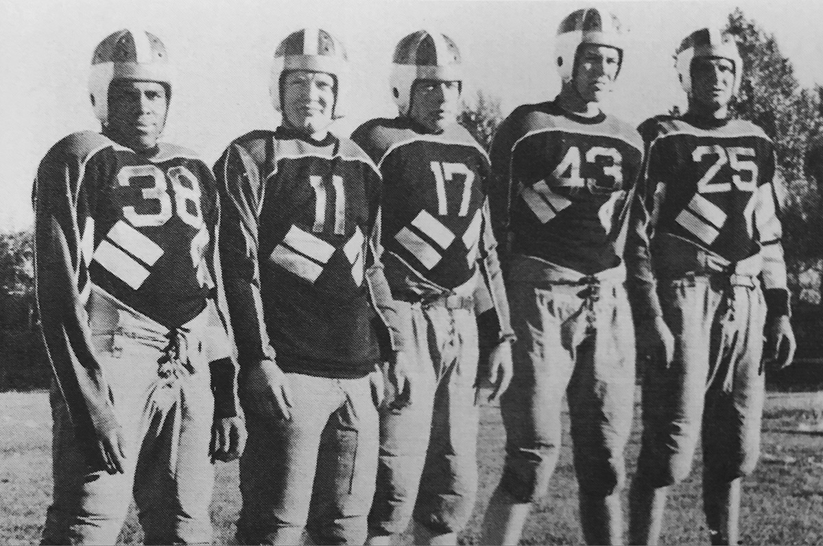 Walter-Springs-In-Football-Uniform-Regis-College-Yearbook-1940-1200x797.jpg