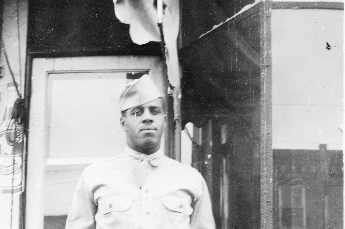 Tech. Sgt. Walter Springs stands in front of a family business while home on furlough in December 1942