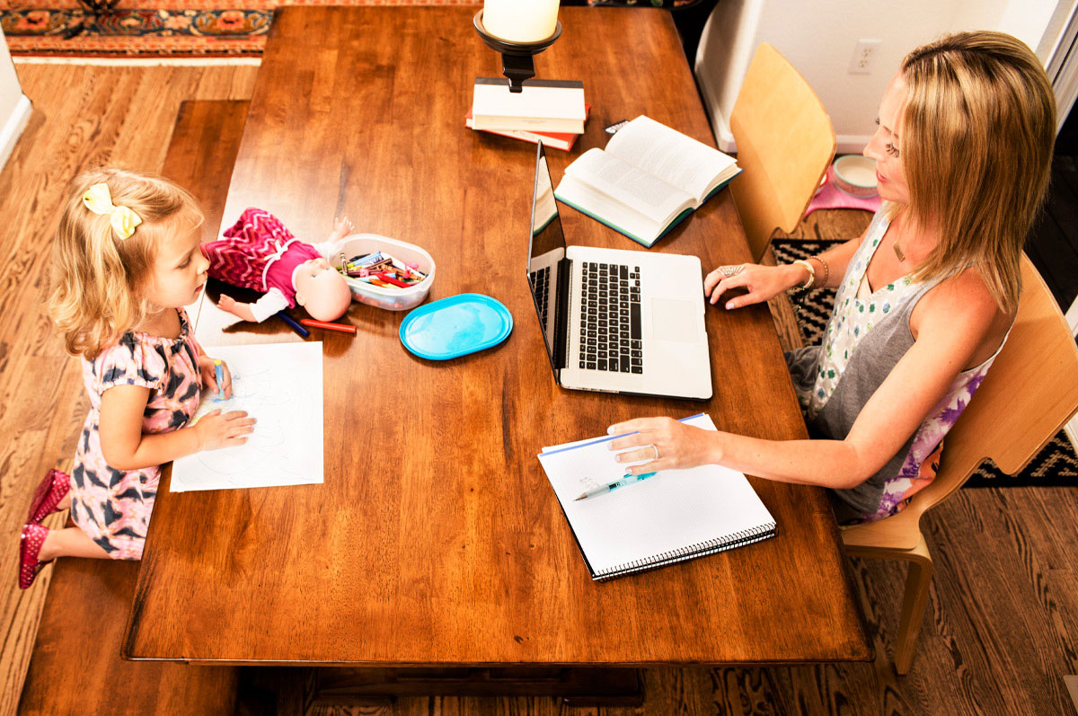 mother and daughter work on their homework together