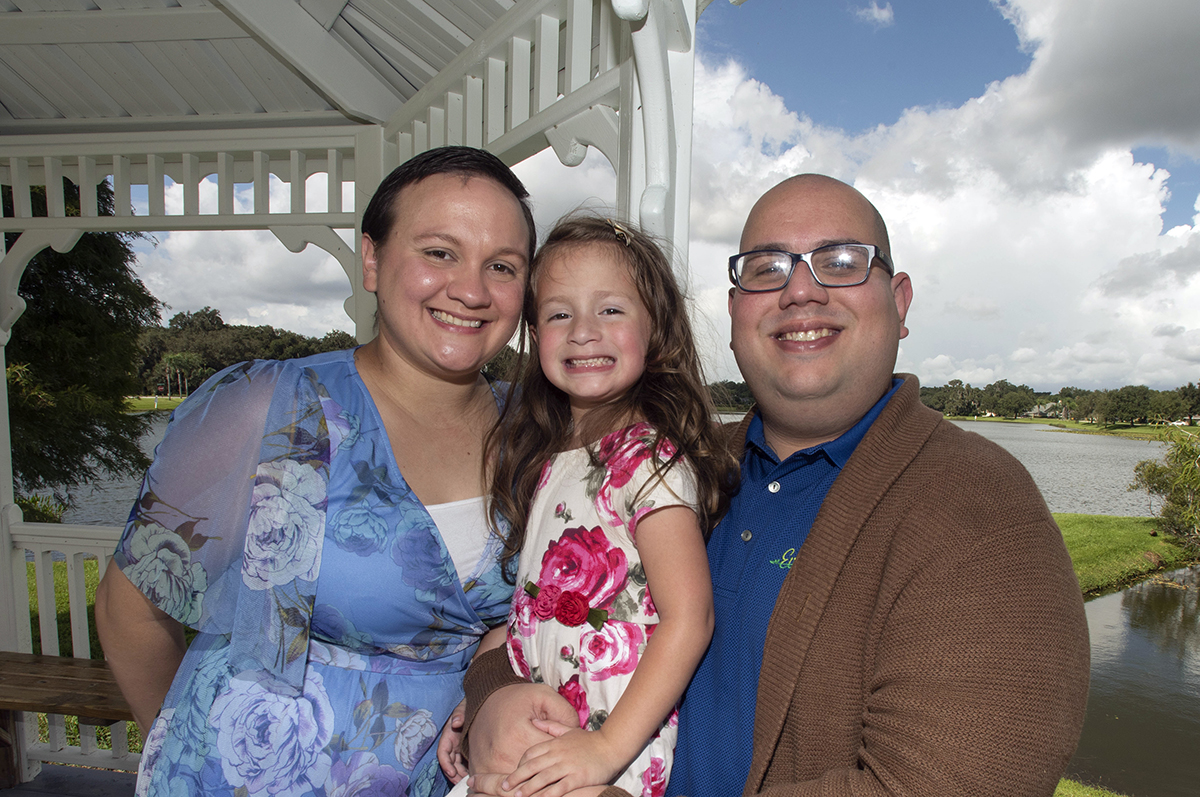 Angelica Maisonet with her daughter and husband after she completed chemo therapy and her master's degree at Regis University