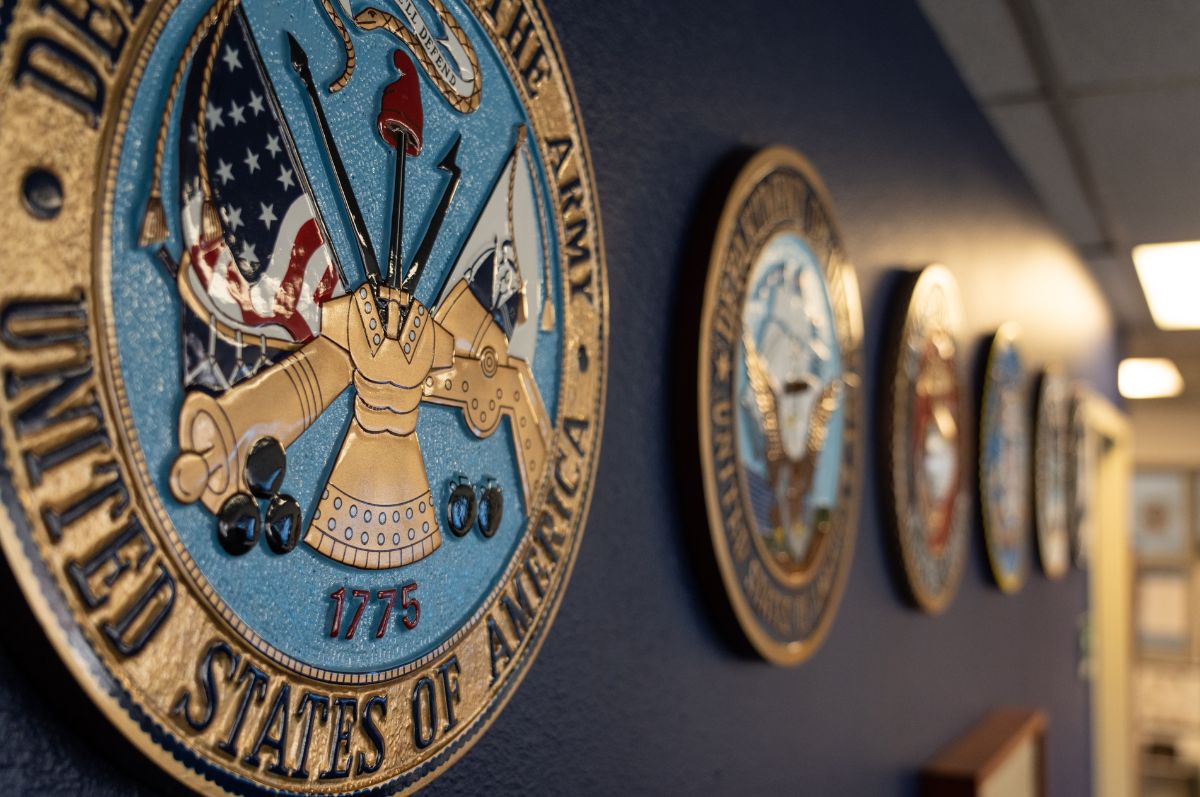 military seals hanging on wall