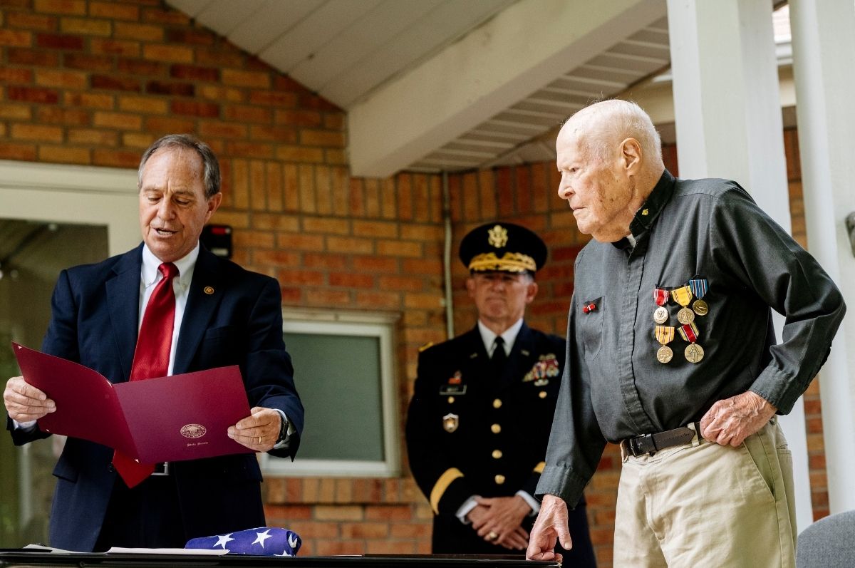 man receiving medals