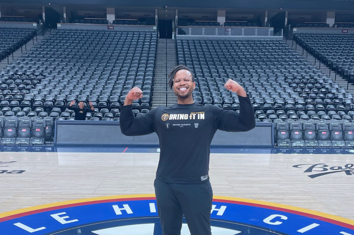 Brandon Johnson poses on Denver Nuggets court