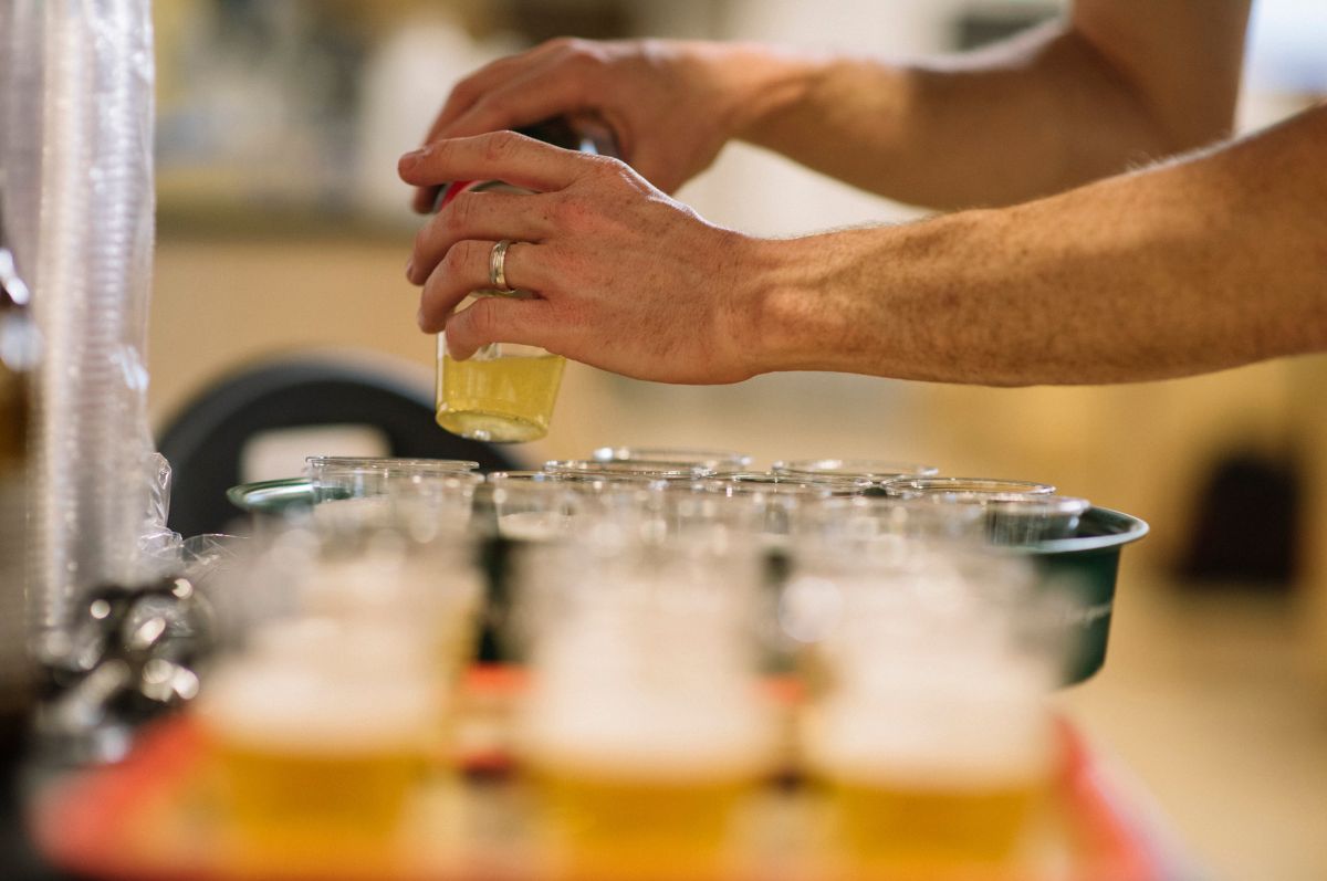 man pours beer