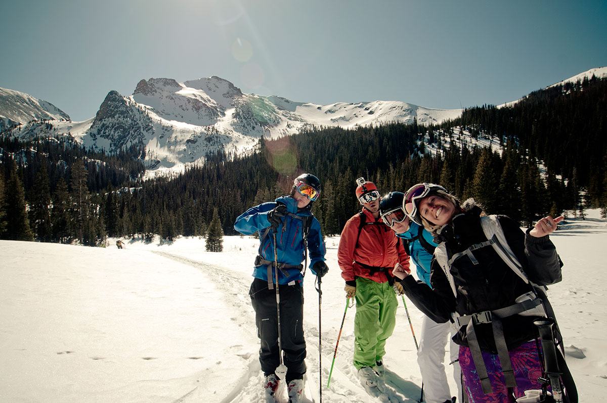 group of college student smiling while skiing