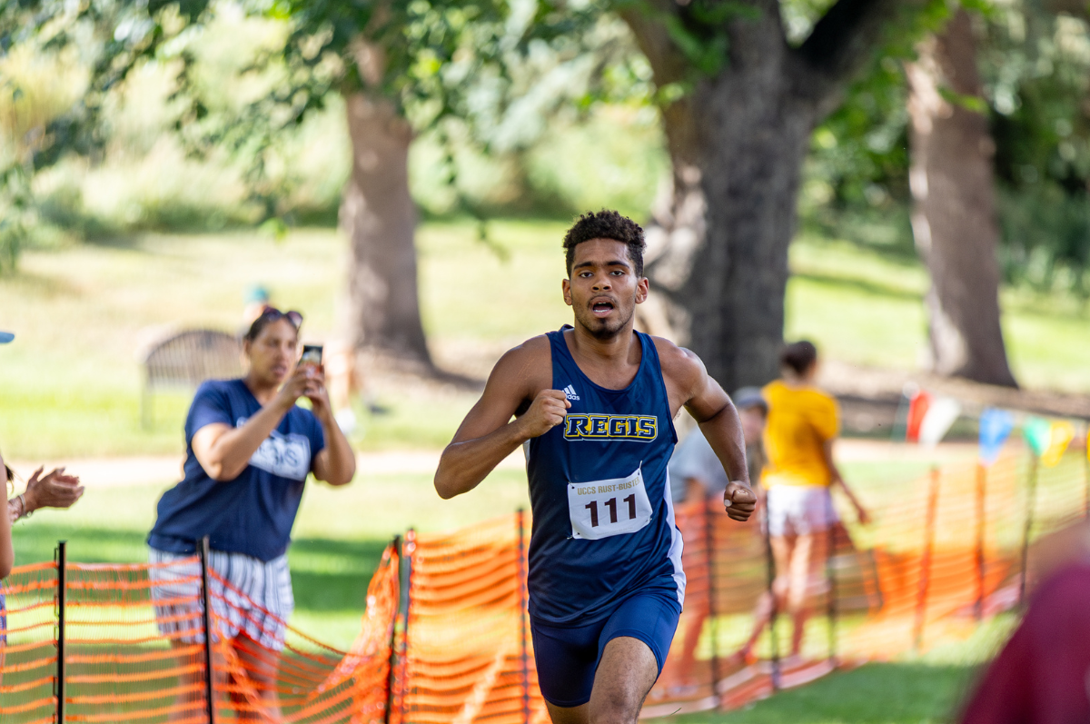 student-athlete runs on course