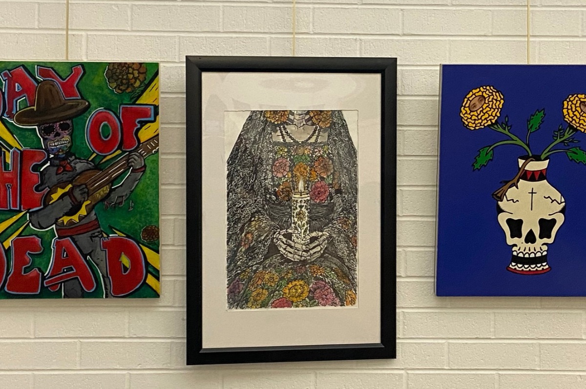 Artwork in the Dia de los Muertos exhibition at Regis in 2026