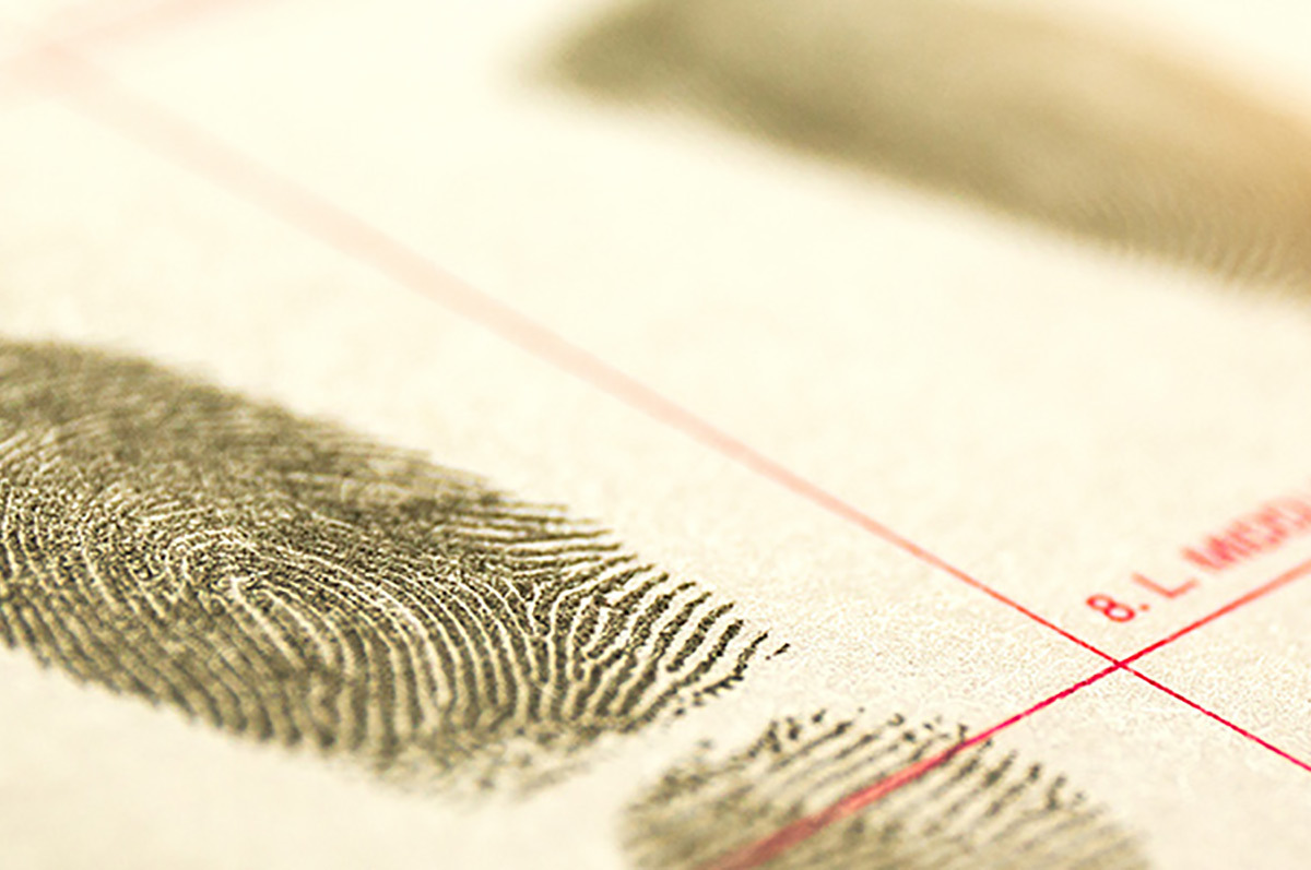 closeup of a fingerprinting card with inked fingerprints