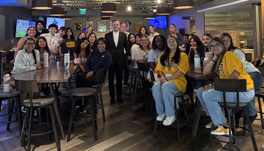 Fr. Hendrickson visiting with Regis PUENTE students