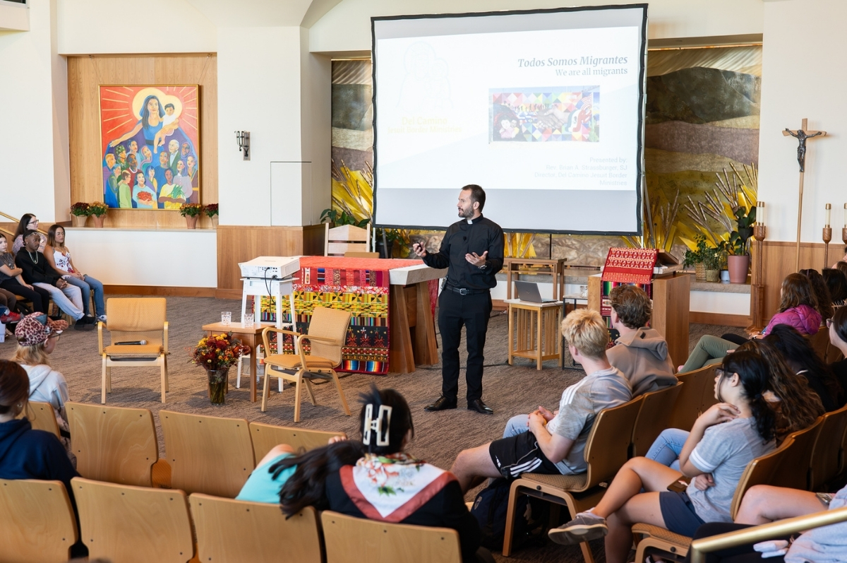 Fr. Strassburger presenting in the Regis chapel